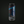 A single beer can centered on a dark studio background. The can is dark gray/black with blue and teal graphic bands, large white vertical text reading 'UNDER LIGHTS,' and smaller text including 'ALL NIGHT IPA' and 'BRISTOL BEER FACTORY.